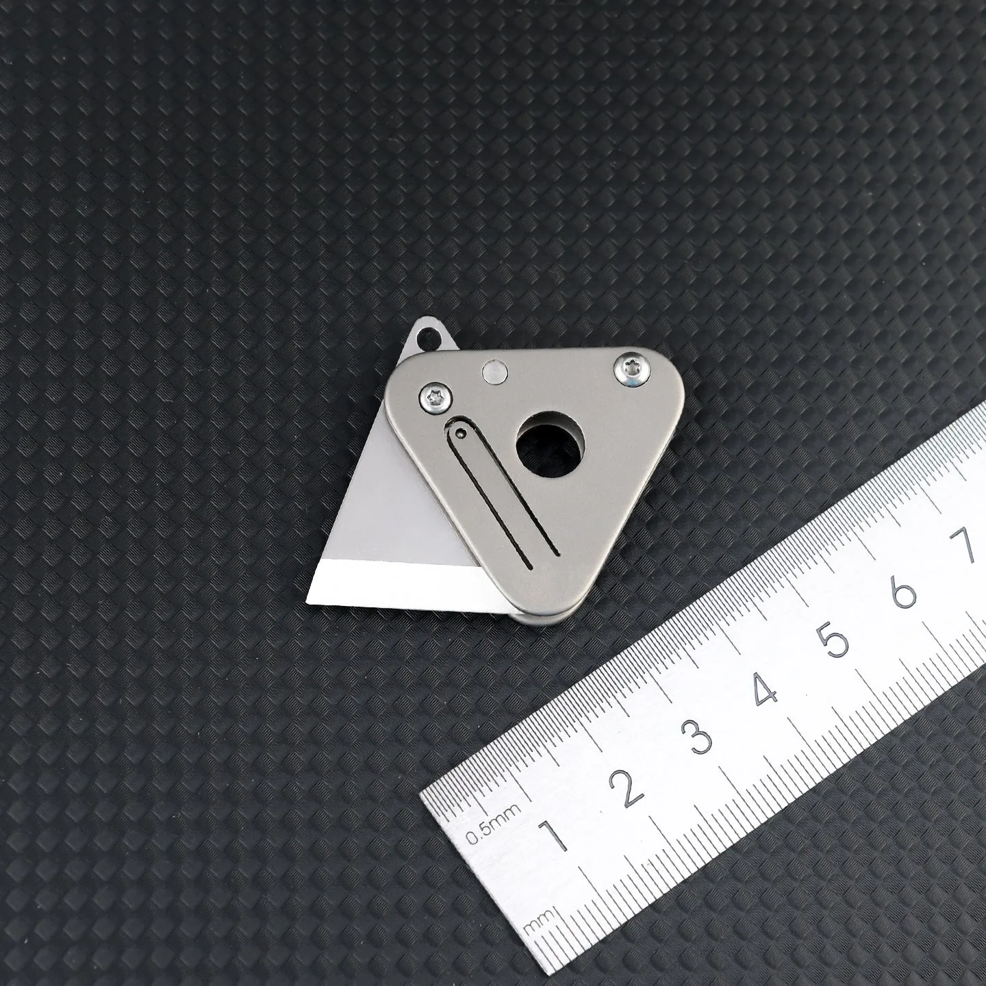 Triangle titanium alloy mini portable knife with stainless steel blade and button lock in silver gray