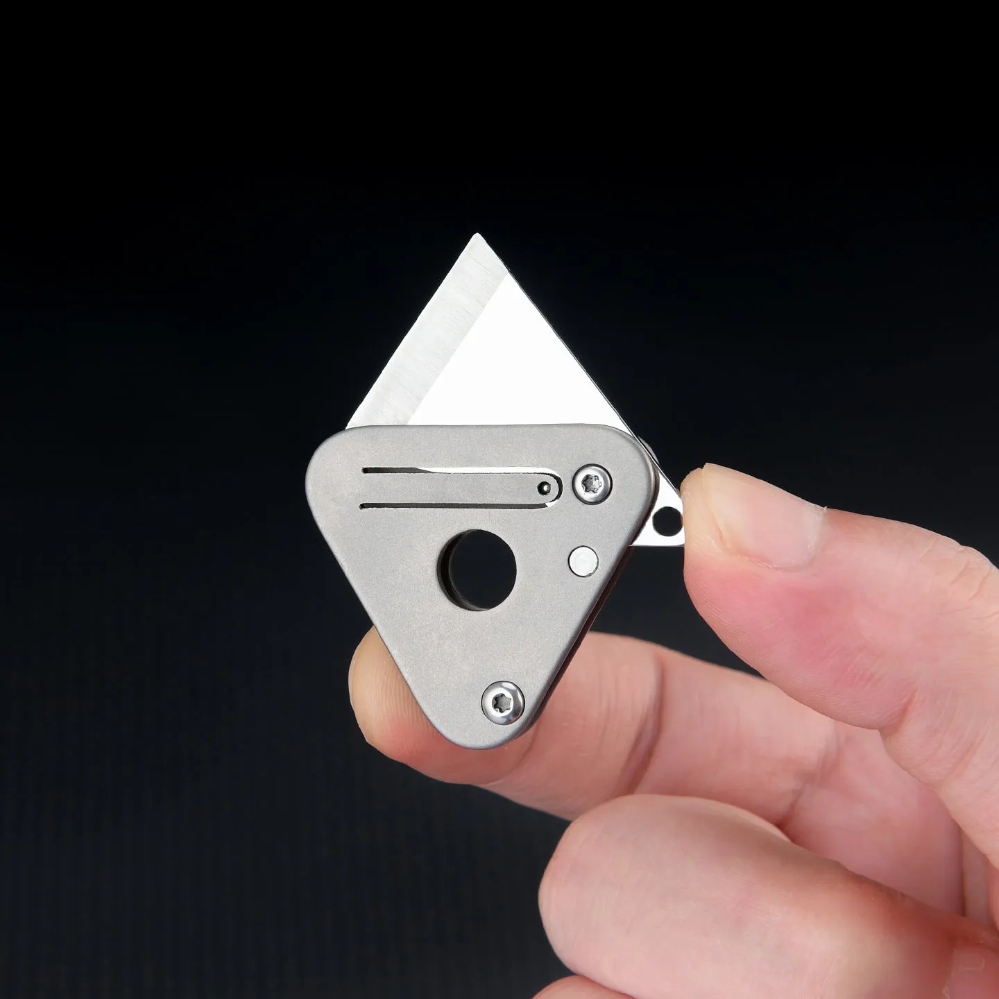 Triangle titanium alloy mini portable knife with stainless steel blade and button lock in silver gray