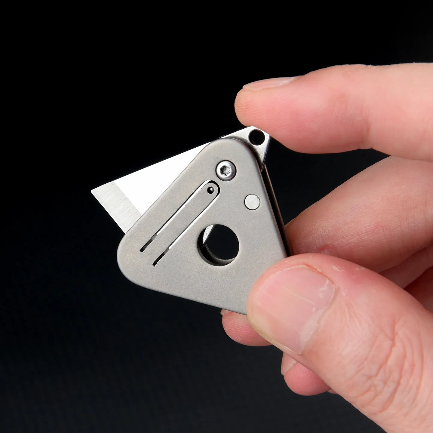 Triangle titanium alloy mini portable knife with stainless steel blade and button lock in silver gray