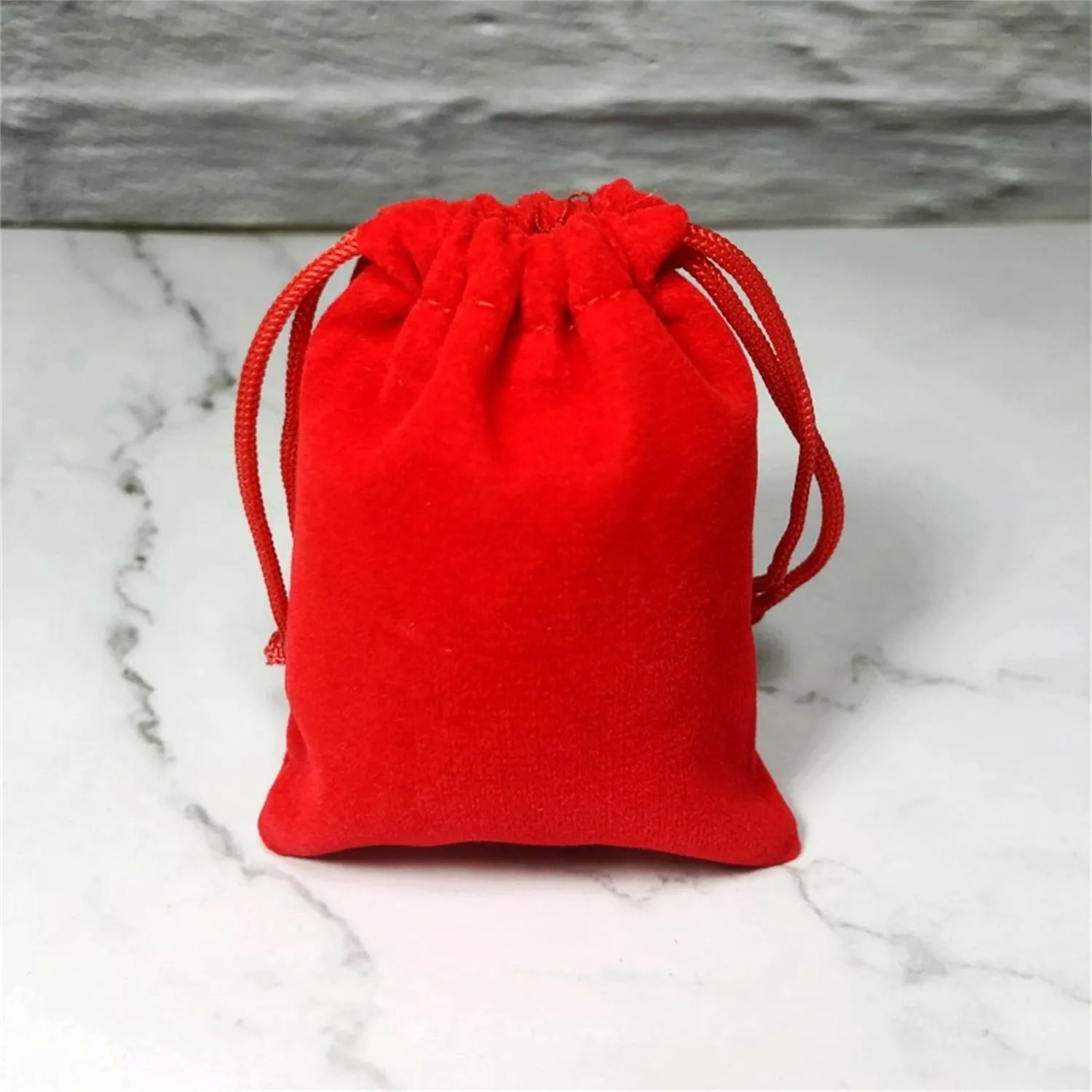 Flannel drawstring bag with beam opening, available in multiple colours and sizes for storage or gifting