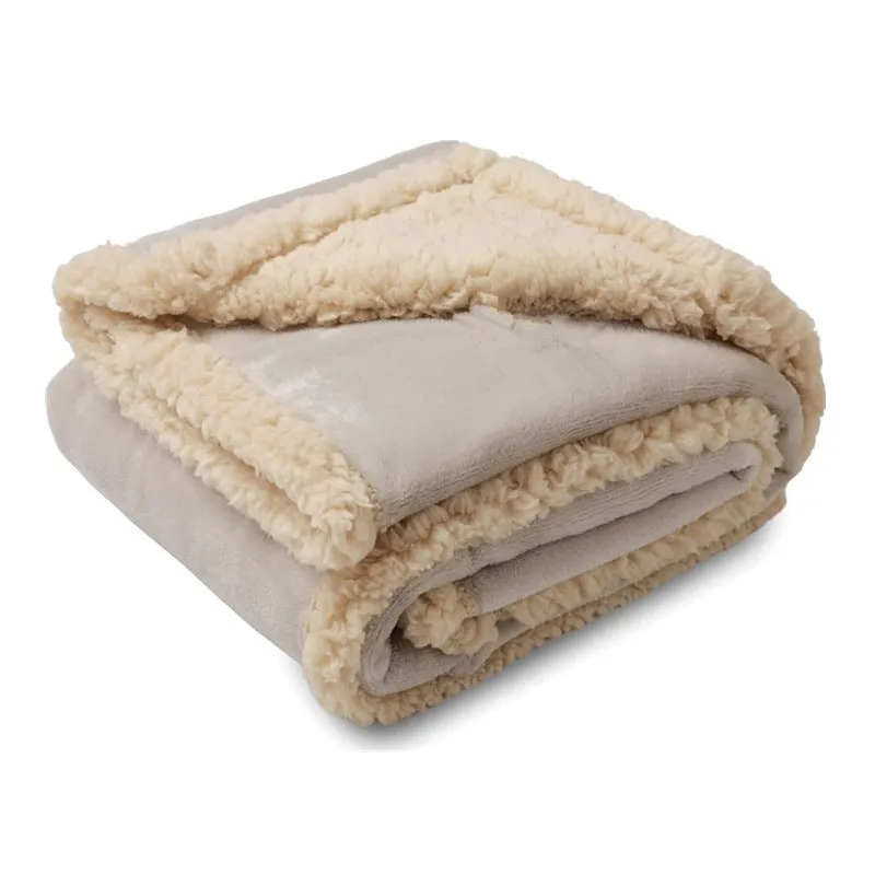 Pet waterproof blanket in beige flannel on a sofa with a dog lying on it