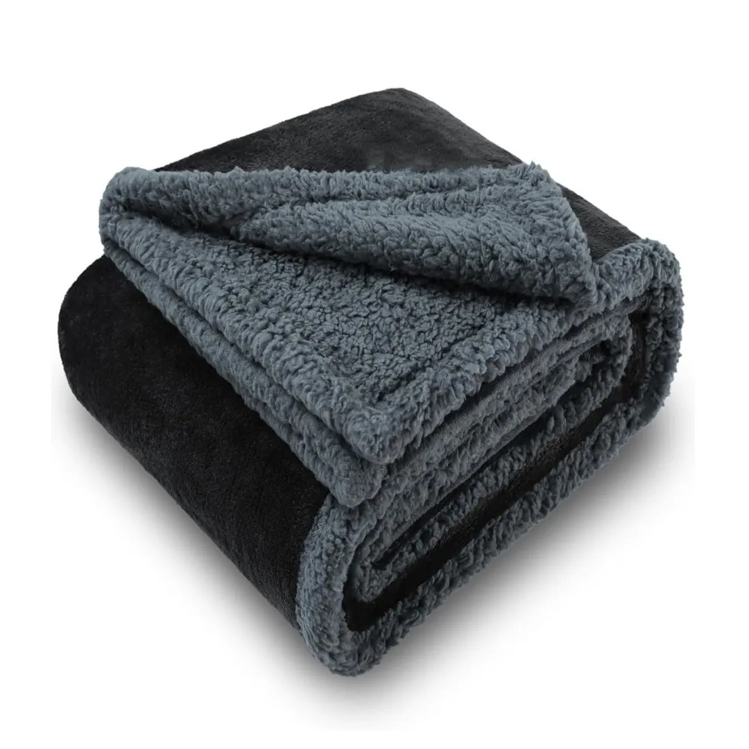 Pet waterproof blanket in beige flannel on a sofa with a dog lying on it