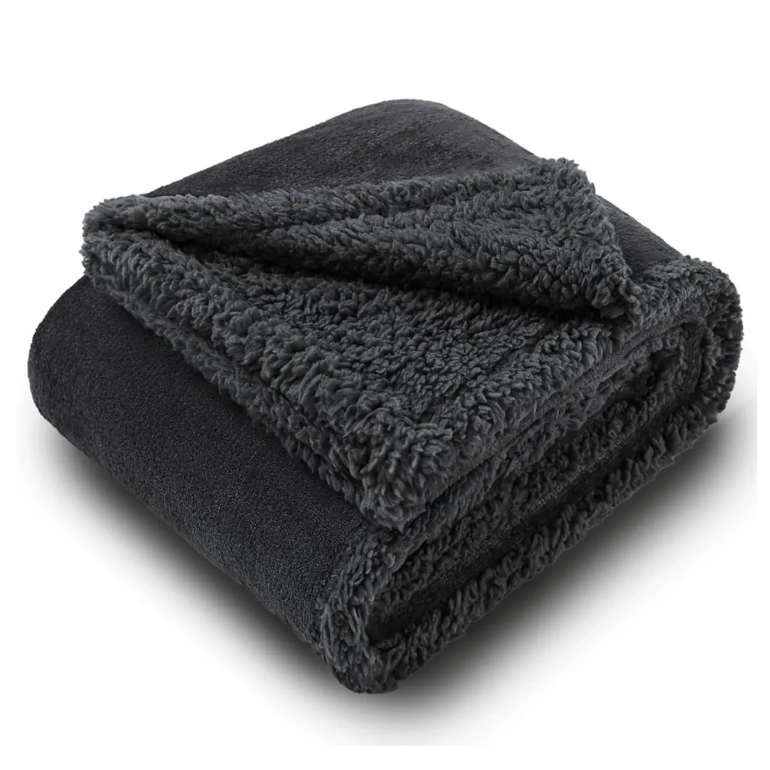Pet waterproof blanket in beige flannel on a sofa with a dog lying on it