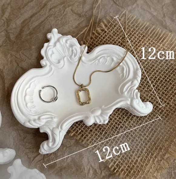 Vintage French relief gypsum jewellery display plate with sculptural plaster design and white matte finish