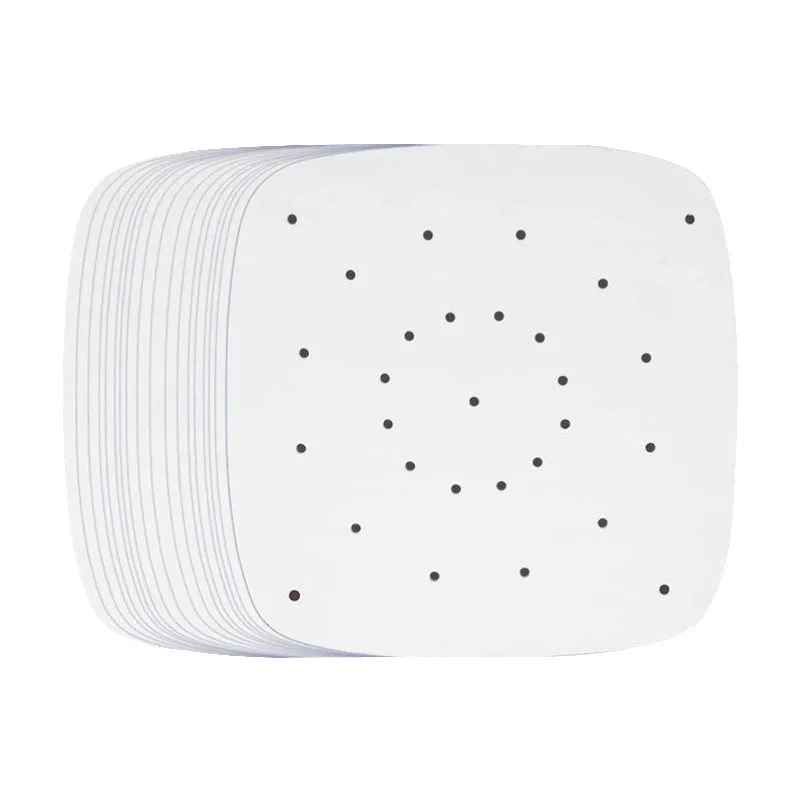 Stack of oiled paper square baking sheets with holes for air fryer use natural colour 20cm