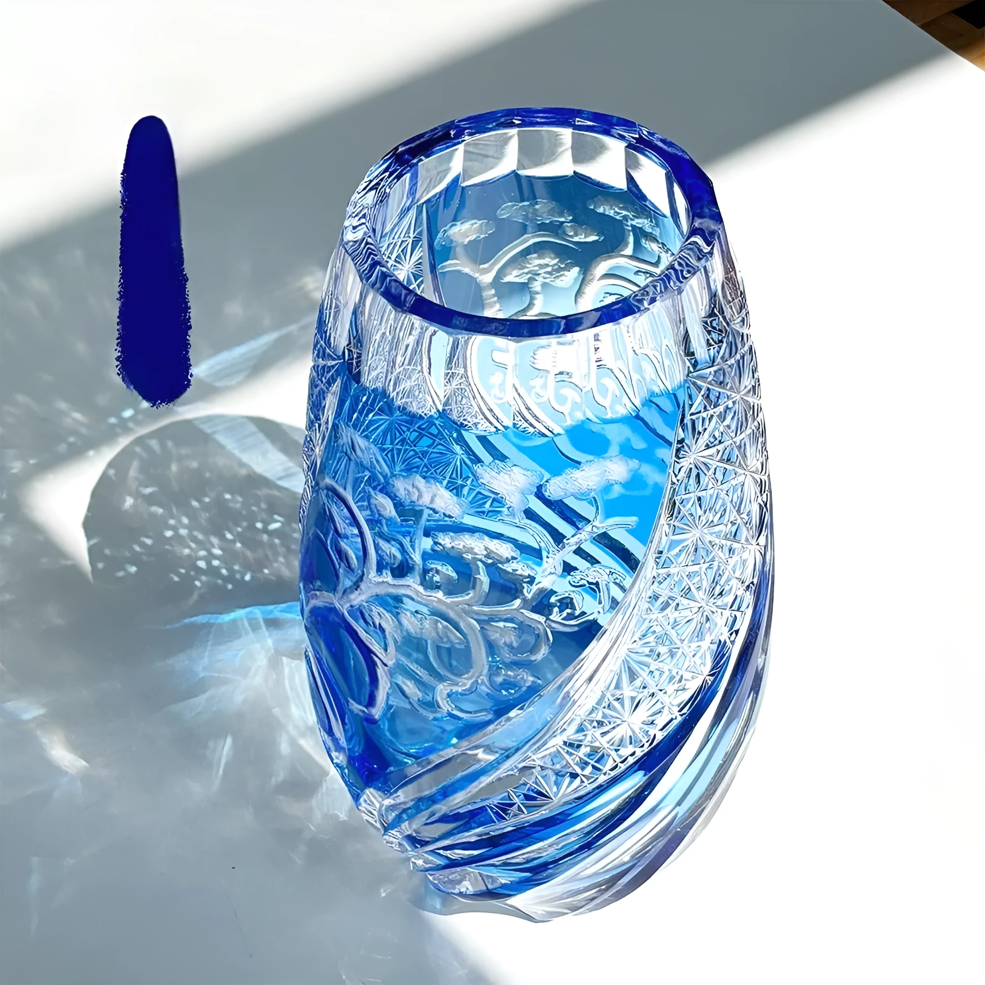 Blue Jianghu cut crystal glass tumbler 80x190mm on a wooden surface