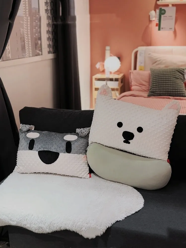 Grey and white West Highland puppy pillow dog cushion on a sofa.