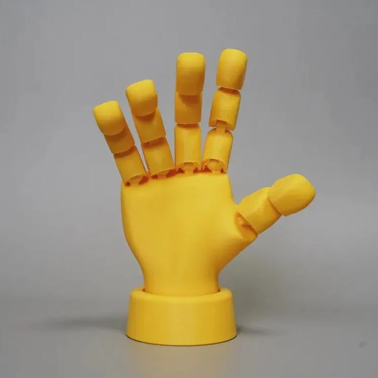 Yellow American-style hand prop figurine with movable joints on a white background