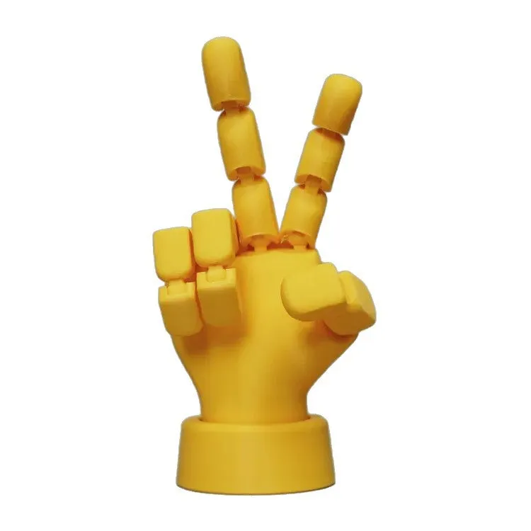 Yellow American-style hand prop figurine with movable joints on a white background