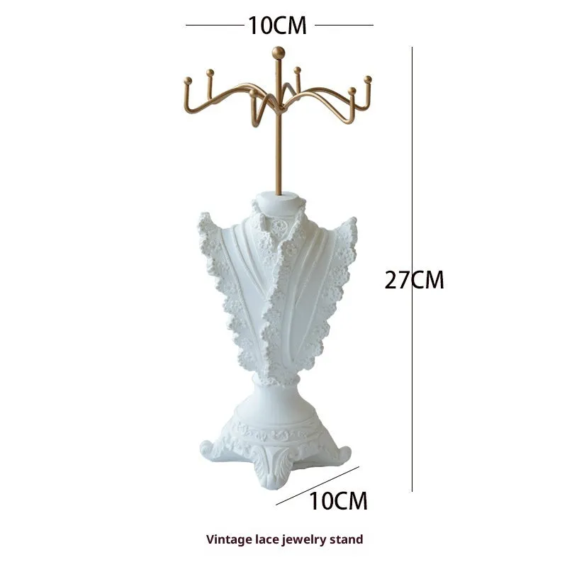 White plaster retro jewellery display stand with three layers, neutral background for necklace display