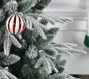Colourful glass ball hanging ornament on a string against a white background