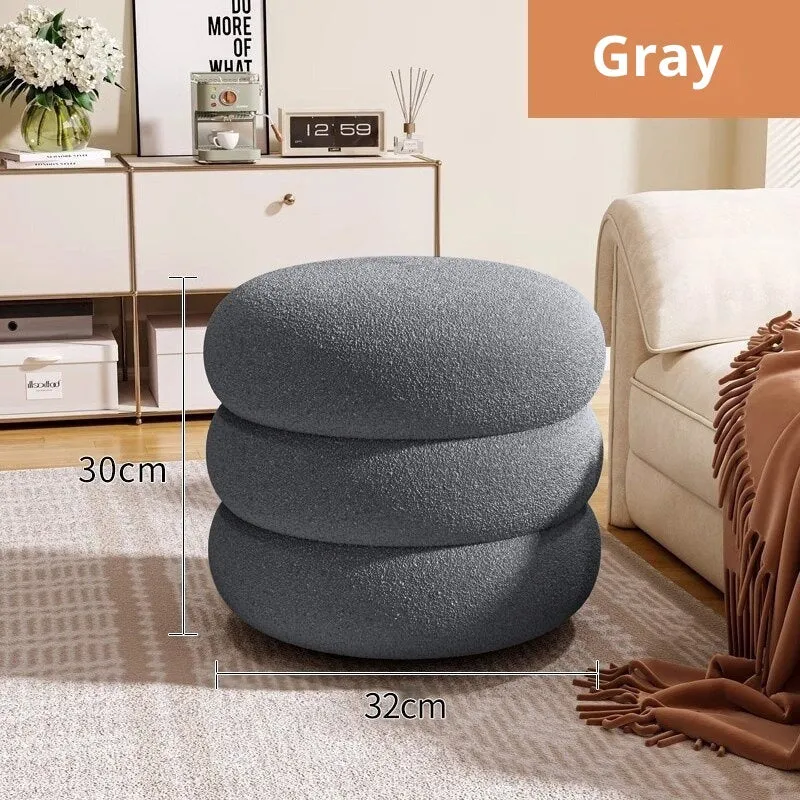 Small cream style round stool with skin-friendly lamb high elastic sponge fill in a living room