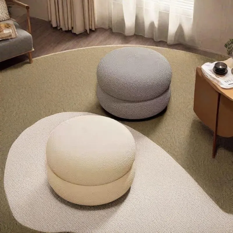 Small cream style round stool with skin-friendly lamb high elastic sponge fill in a living room