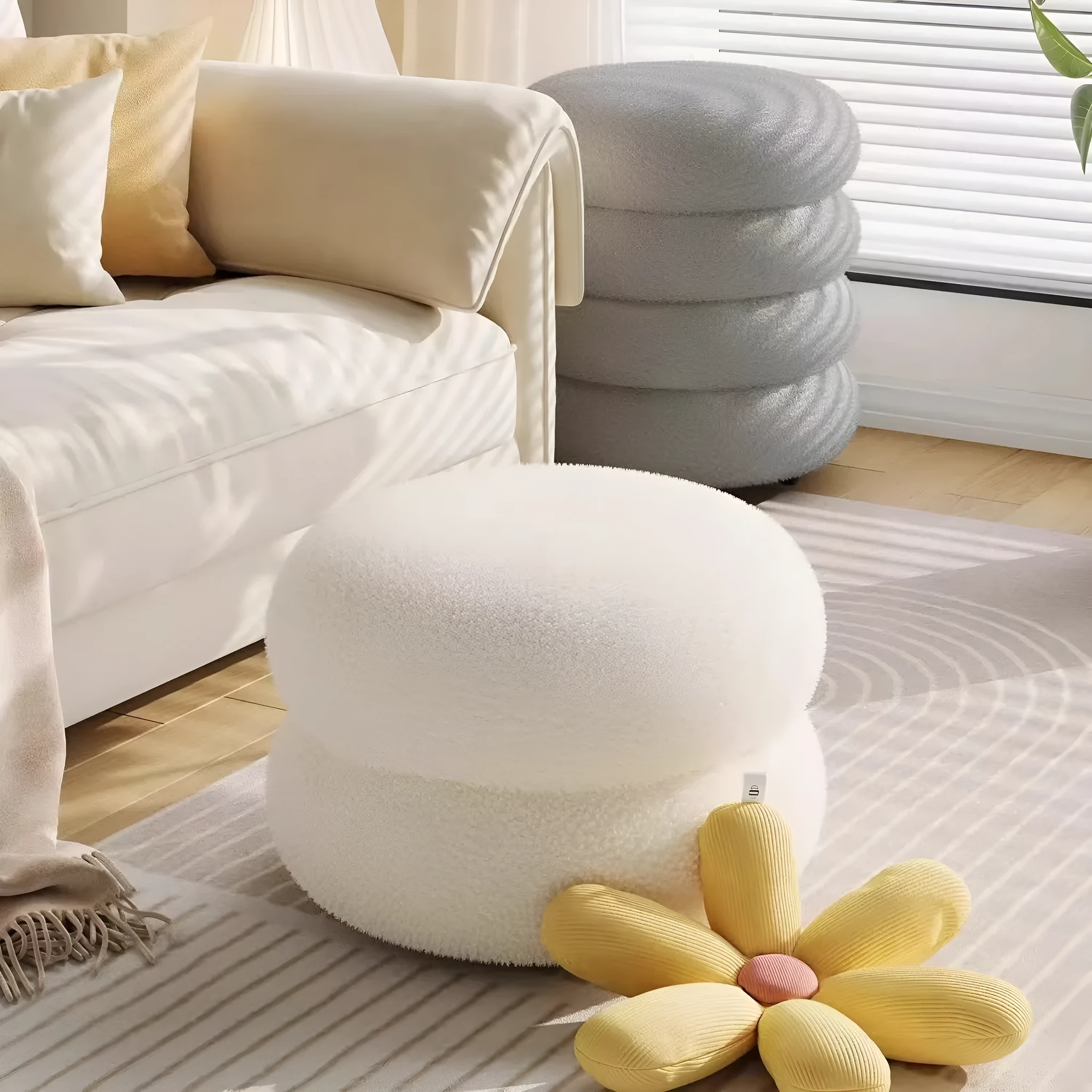 Small cream style round stool with skin-friendly lamb high elastic sponge fill in a living room