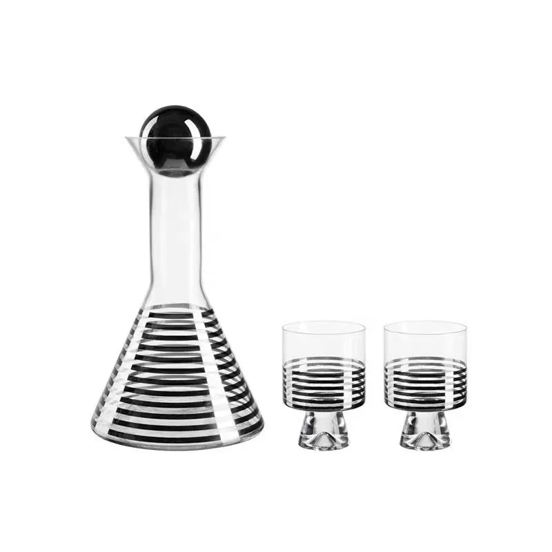 Modern black striped glass cold water bottle 1000ml with two cups on a light surface