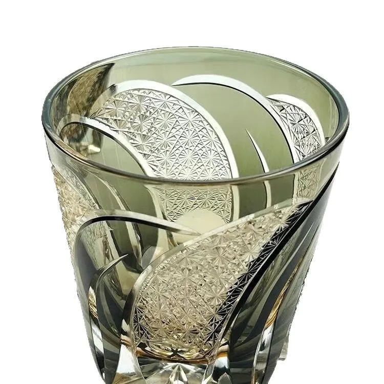 Amber gray crystal glass wine glass with rainbow effect on table, single retro cup