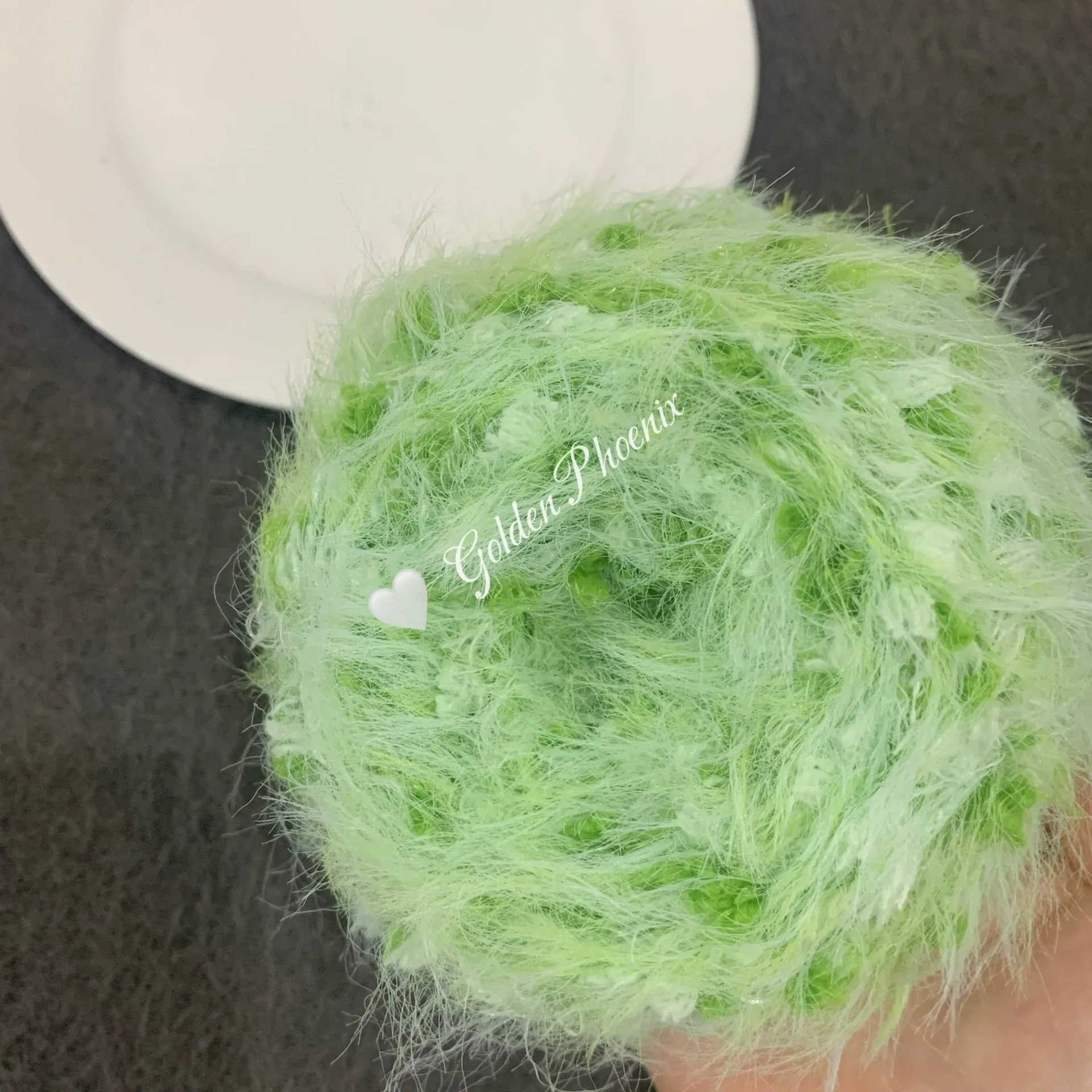 Hand-woven soft polyester yarn in green with 6mm crochet effect texture on skein