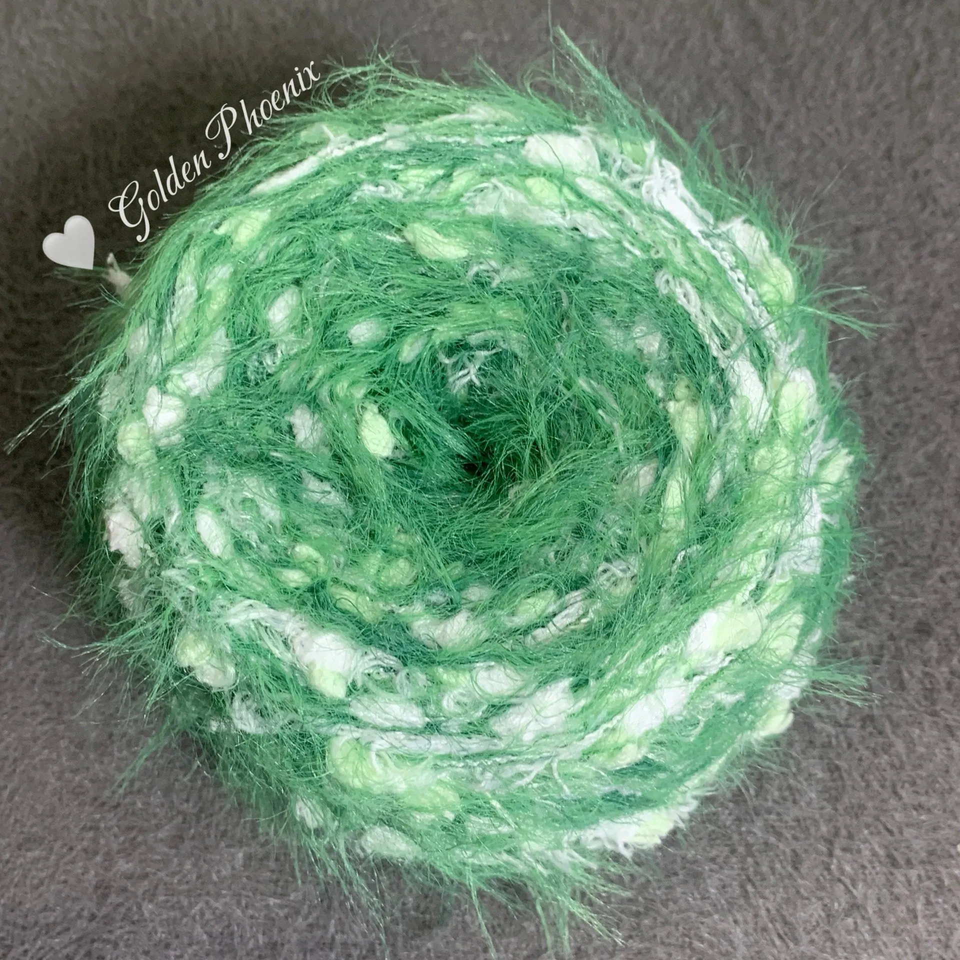 Hand-woven soft polyester yarn in green with 6mm crochet effect texture on skein