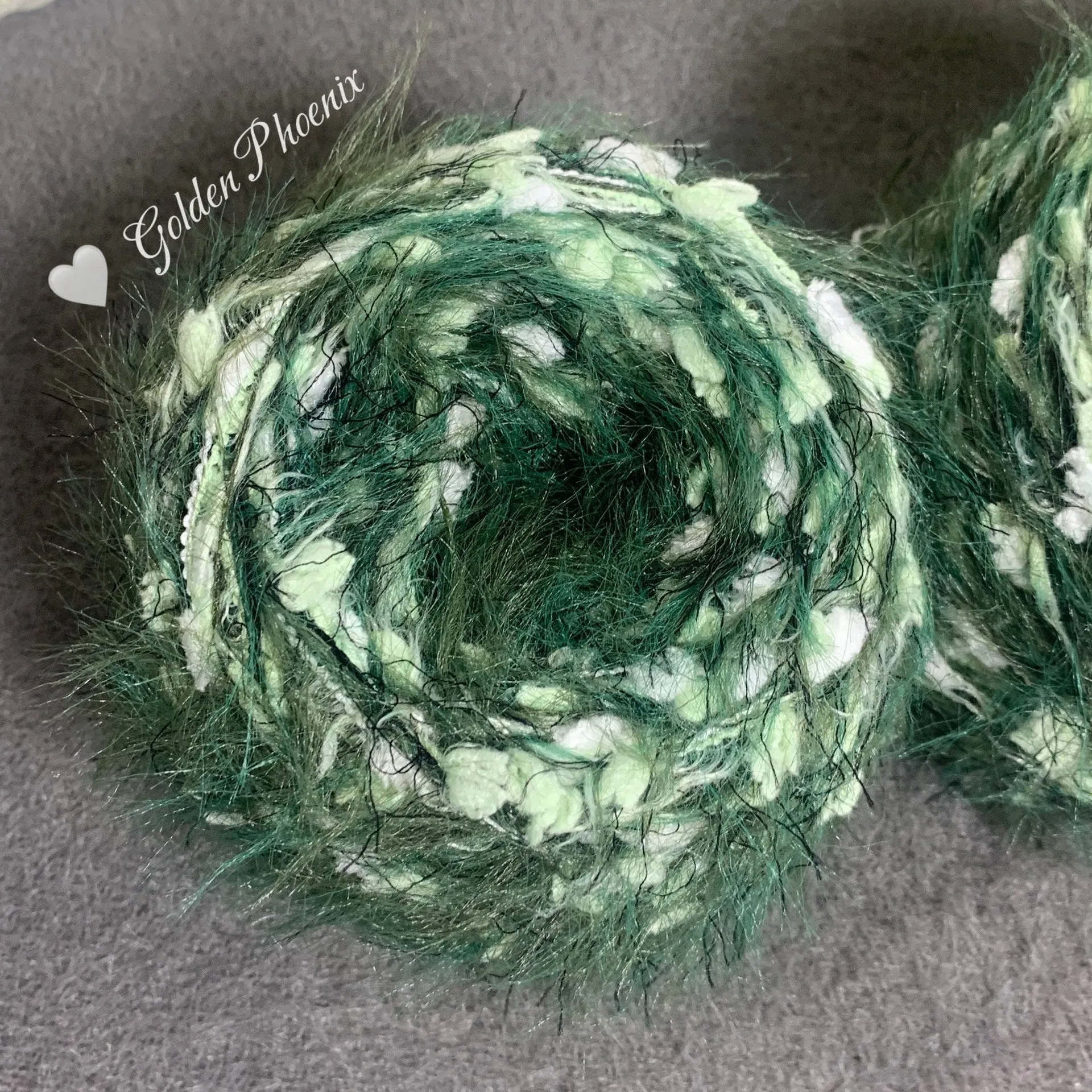 Hand-woven soft polyester yarn in green with 6mm crochet effect texture on skein