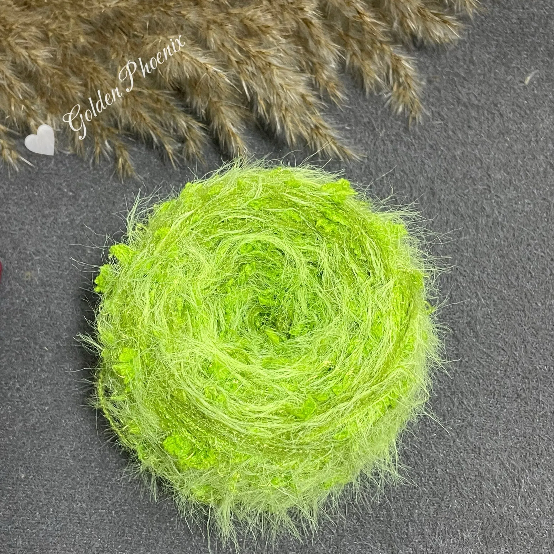 Hand-woven soft polyester yarn in green with 6mm crochet effect texture on skein