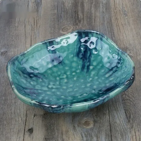 Creative ceramic Japanese-style irregular shaped bowl with floral decoration and sauce dish