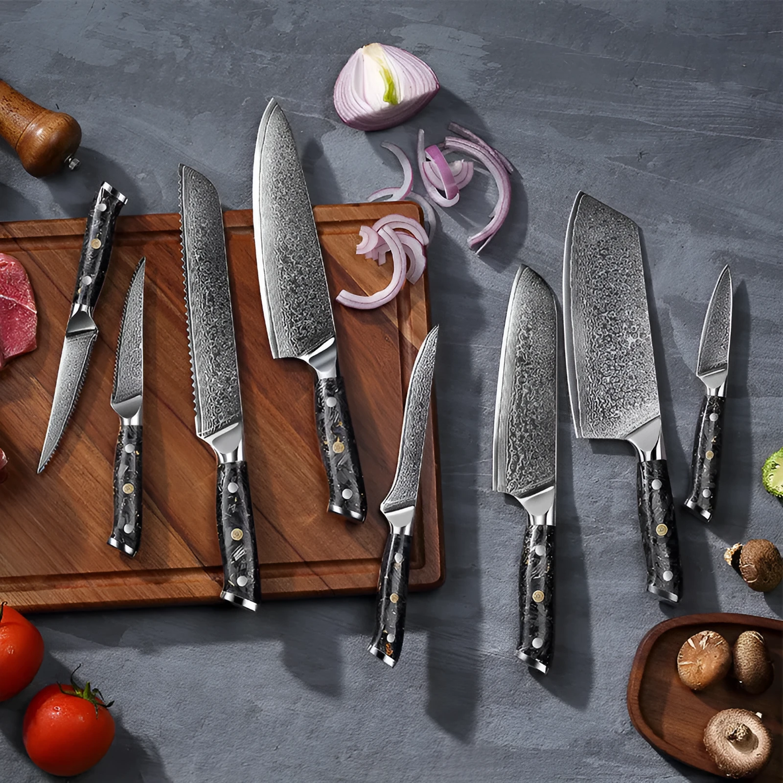 Eight-piece Damascus steel kitchen knife set showing fishbone pattern, including chef, boning, utility, and fruit knives.