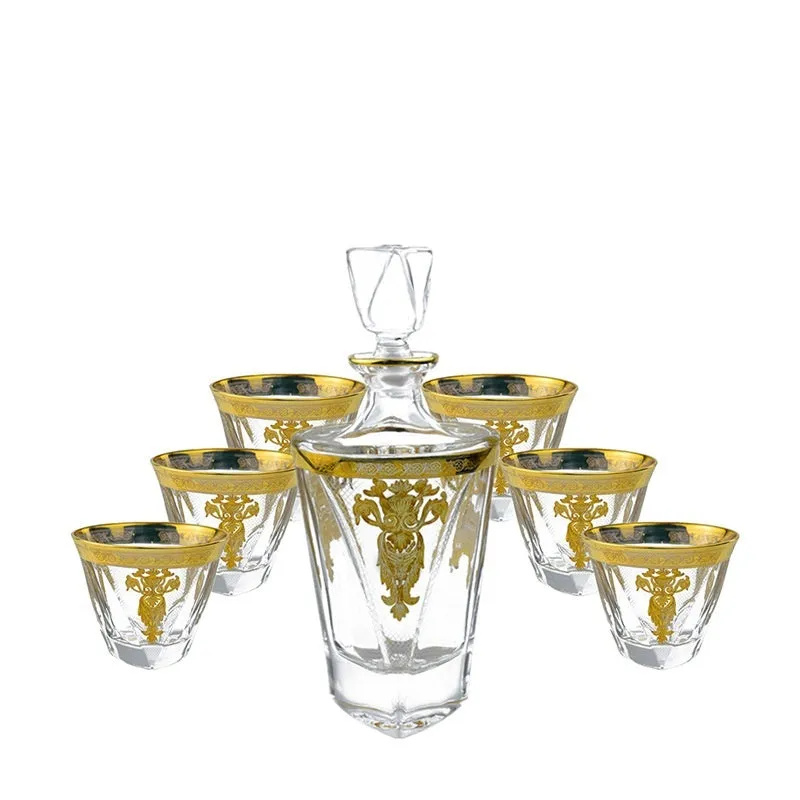 Gold line crystal glass whisky tumbler set with wine bottle and six glasses on a table