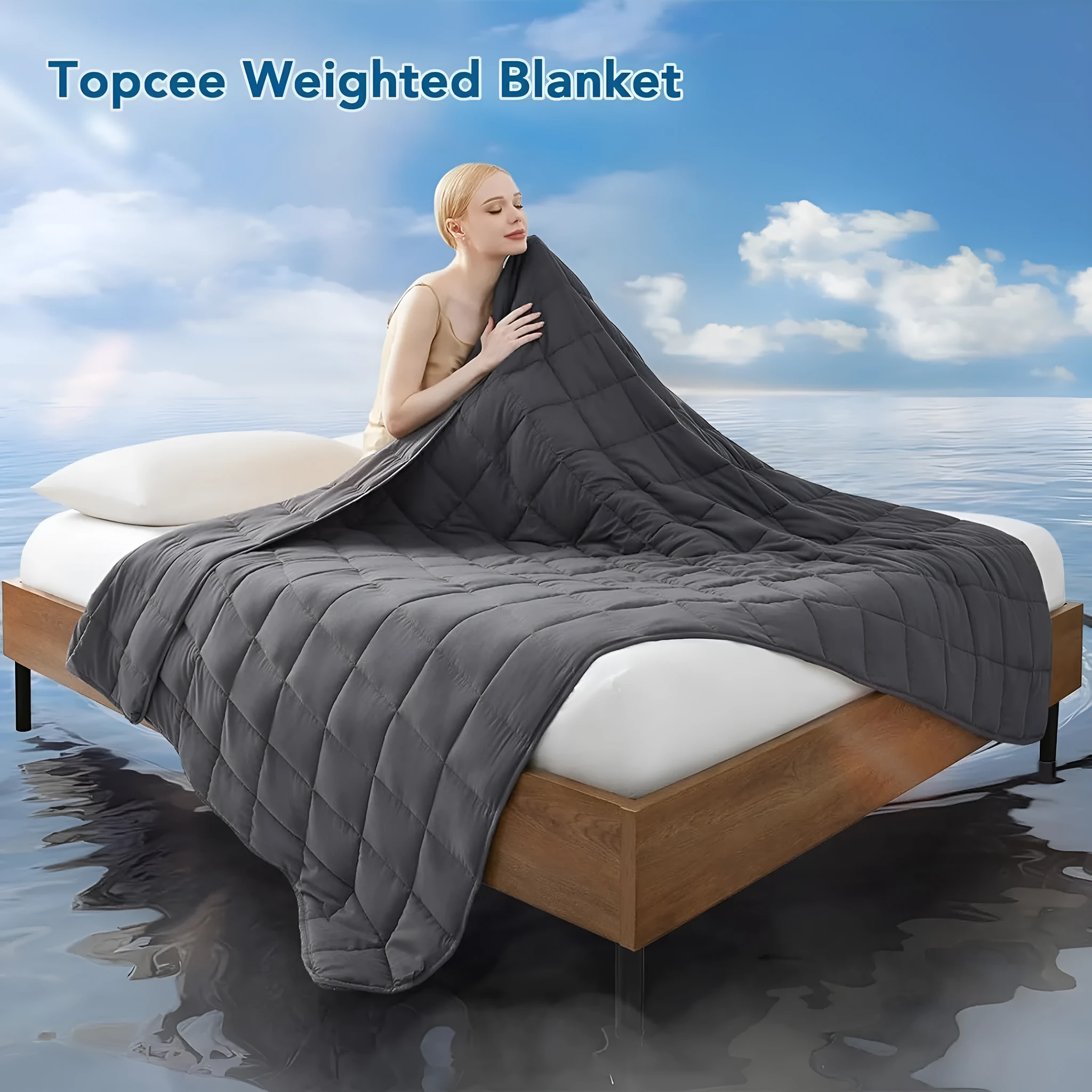 Polyester gravity blanket in solid light grey on bed, 152x203cm size, 12 lb weight option