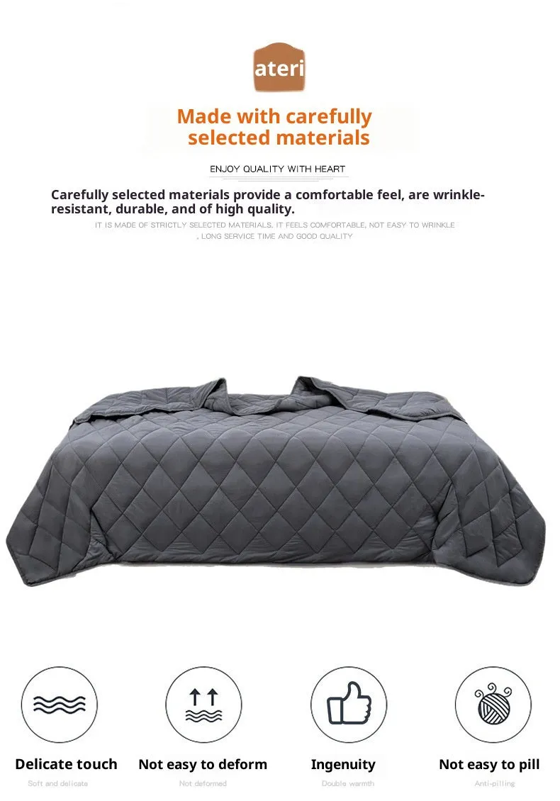 Polyester gravity blanket in solid light grey on bed, 152x203cm size, 12 lb weight option