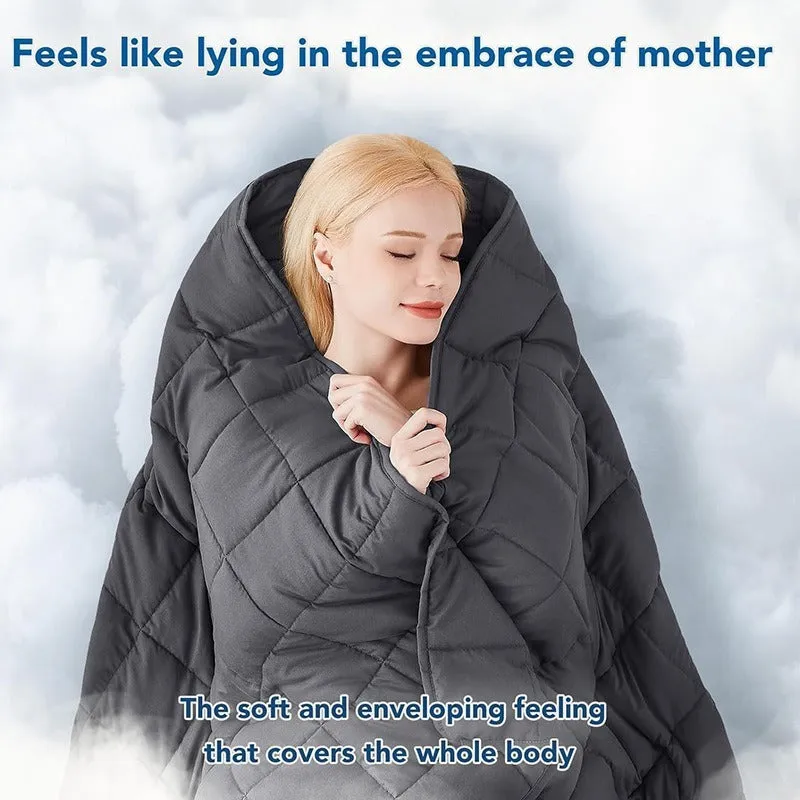 Polyester gravity blanket in solid light grey on bed, 152x203cm size, 12 lb weight option