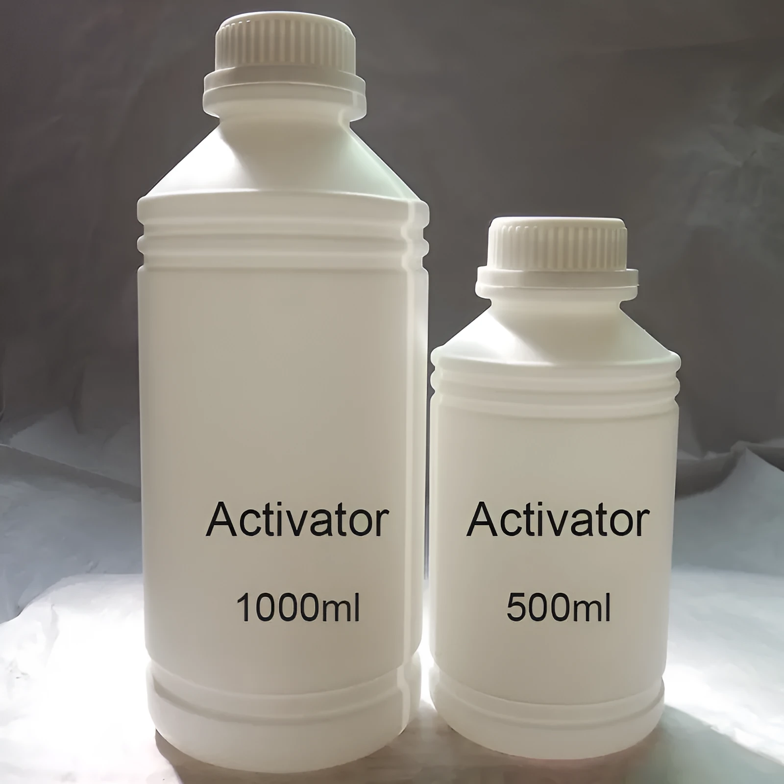 One litre bottle of eco-solvent ink activator for water transfer printing with strong tensile property
