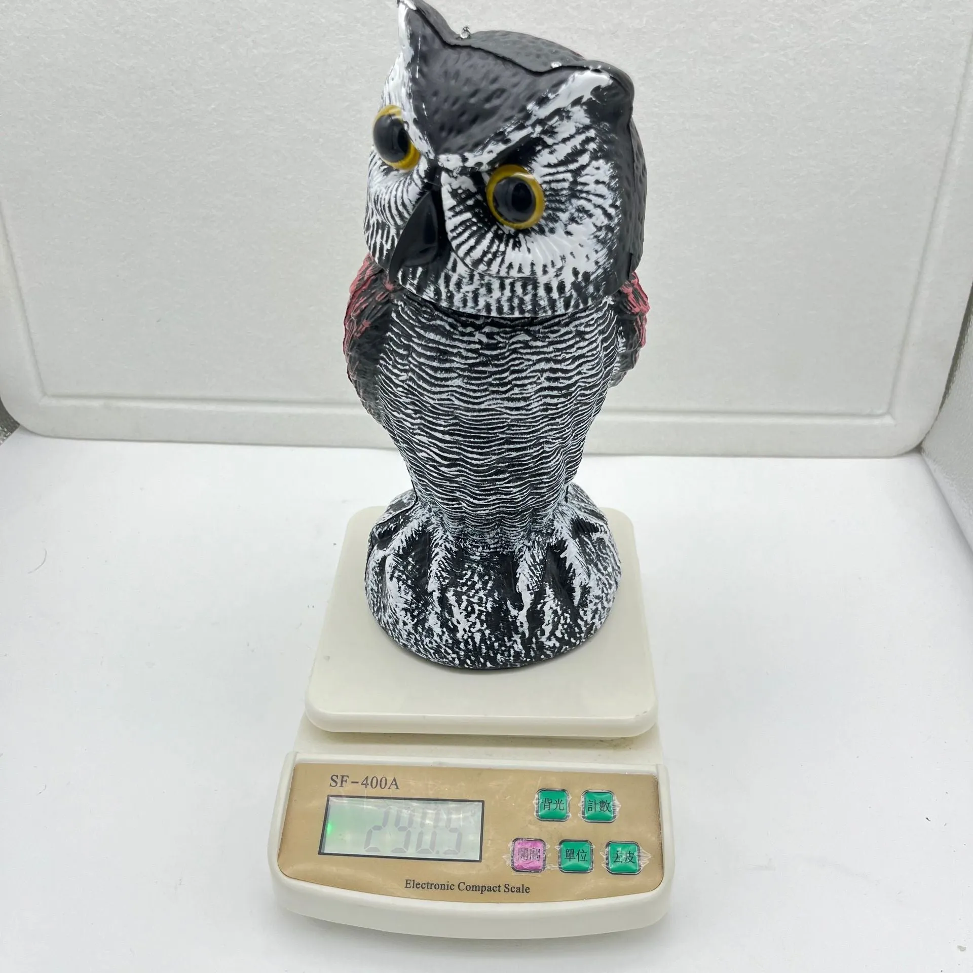 Artificial owl bait ornament with shaking head mechanism for outdoor bird deterrent