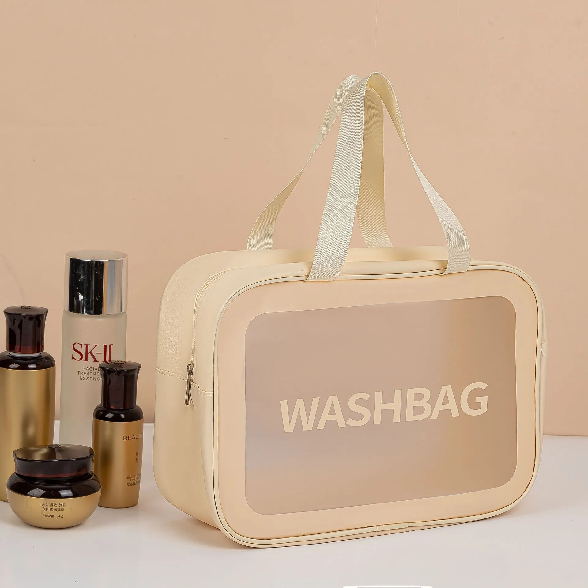 Large PVC transparent cosmetic bag three-piece set in various colours including beige, black, blue, pink, and white, empty and open on a flat surface