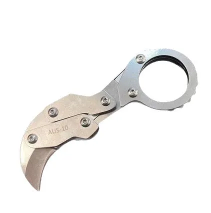 Small stainless steel 420J2 folding knife with 2.6cm blade on table