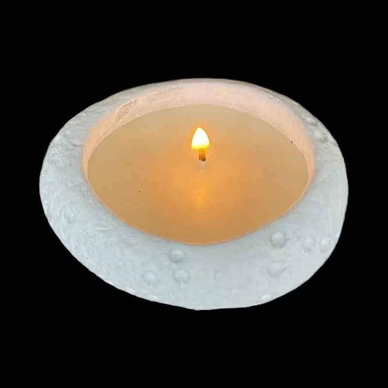 White cement fair-faced candlestick ornament for aromatherapy candles on a shelf