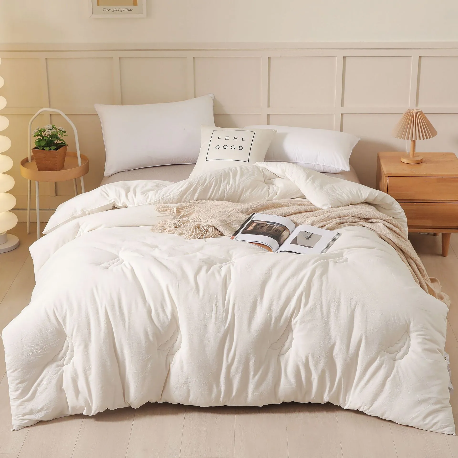 A pure cotton soybean fibre quilt in grey, shown folded, with details of its twill weave and size label.