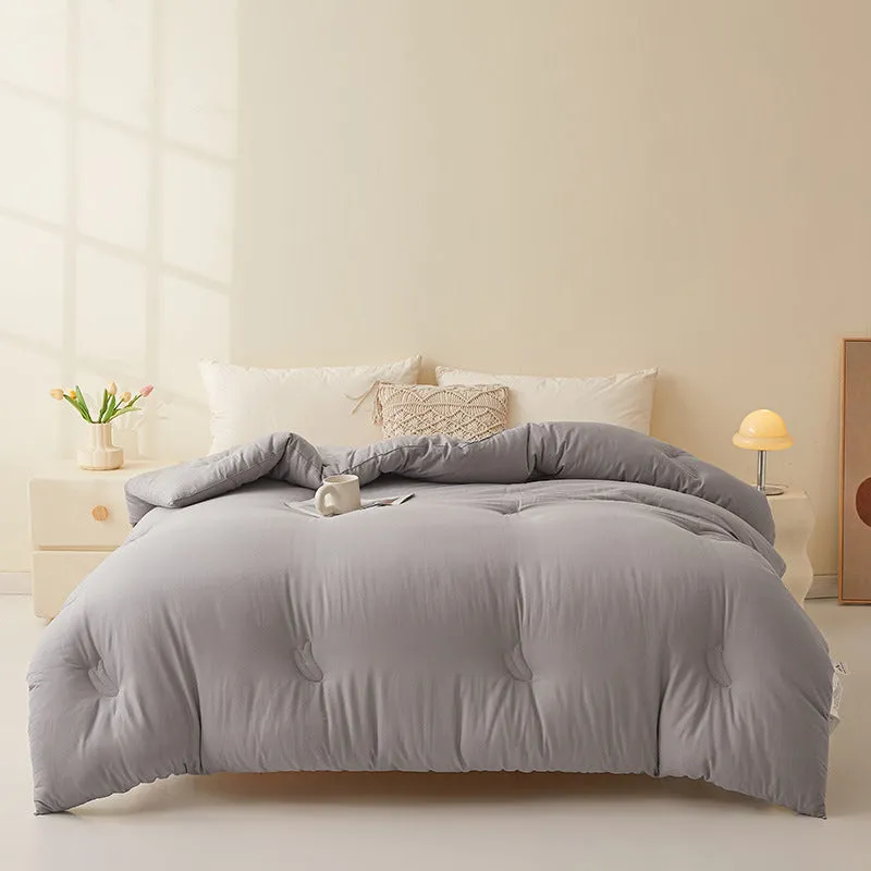 A pure cotton soybean fibre quilt in grey, shown folded, with details of its twill weave and size label.