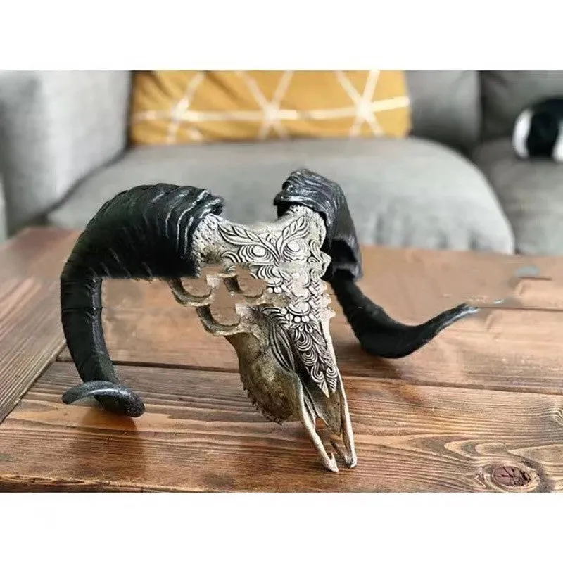 Grey resin horn wall decoration with bull head totem design mounted on a wall indoors