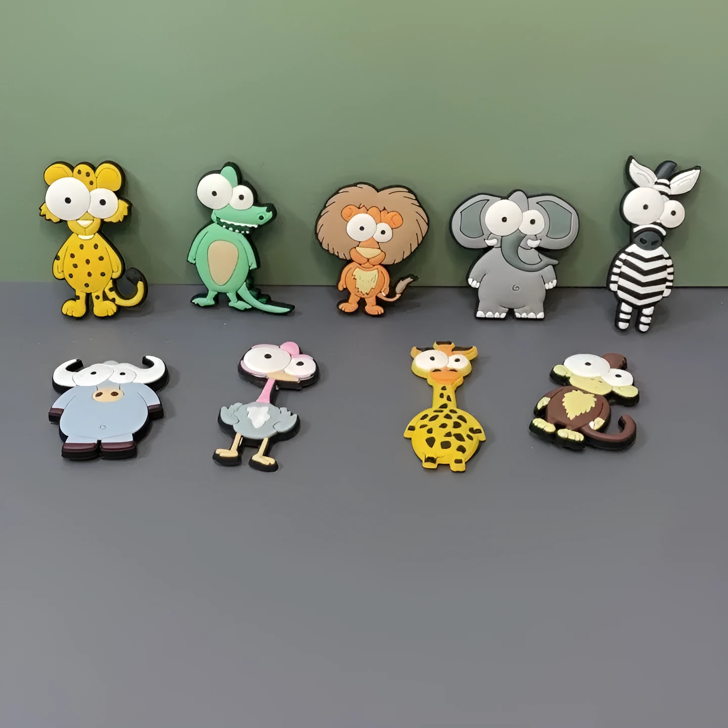 Set of 9 colourful PVC cartoon animal refrigerator stickers on a white fridge surface