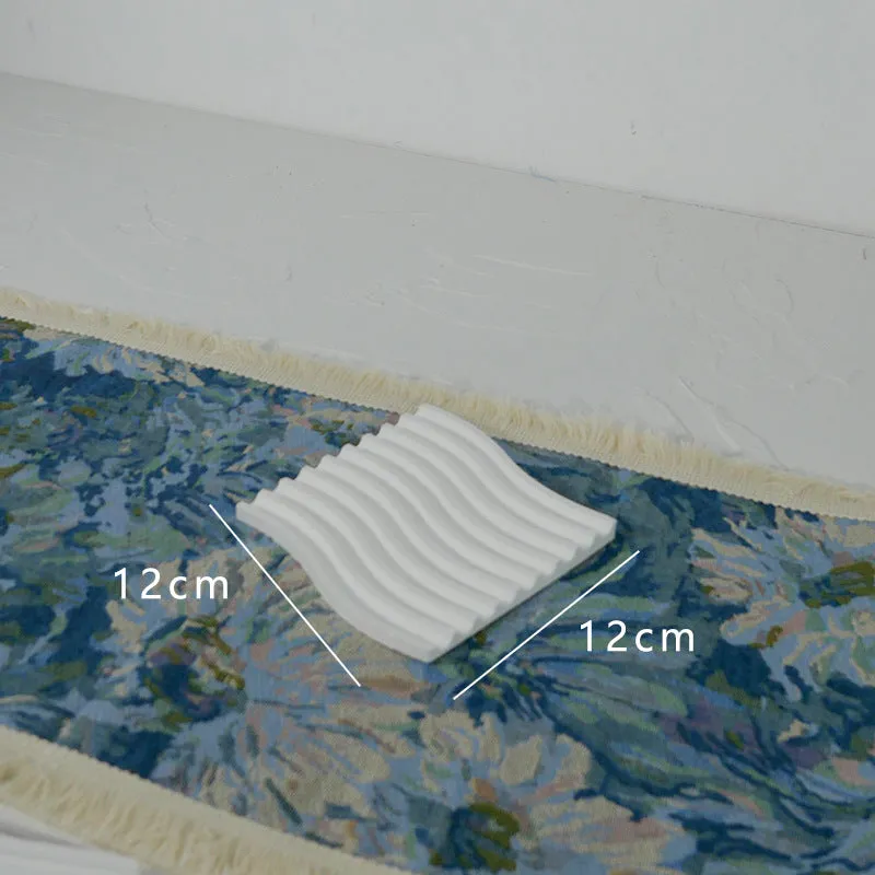 Handmade plaster jewellery display tray with necklaces and bracelets on a countertop