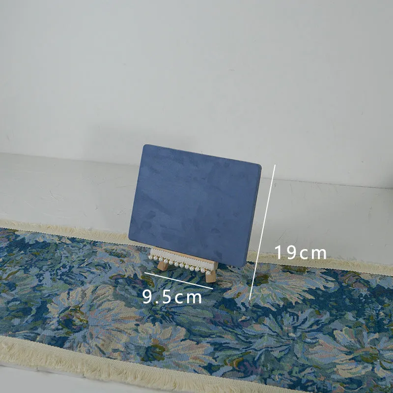 Handmade plaster jewellery display tray with necklaces and bracelets on a countertop