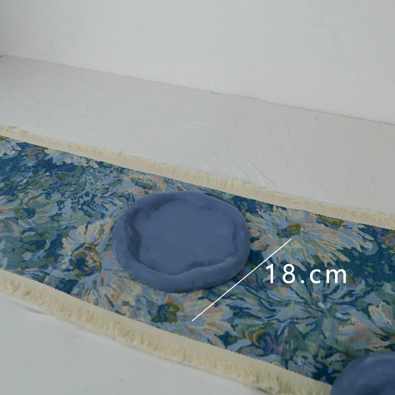 Handmade plaster jewellery display tray with necklaces and bracelets on a countertop