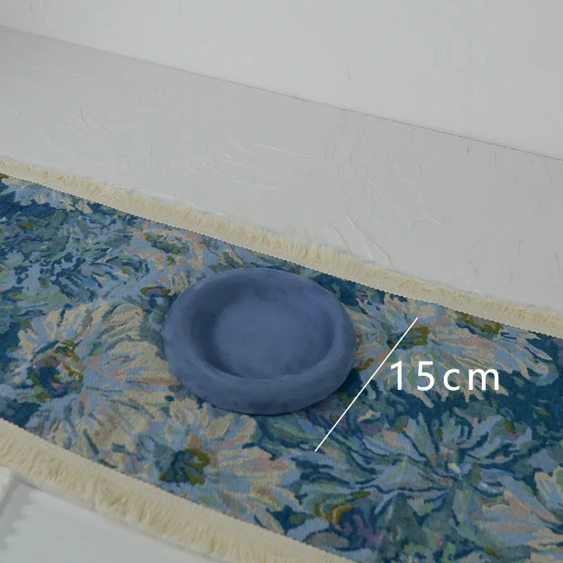 Handmade plaster jewellery display tray with necklaces and bracelets on a countertop