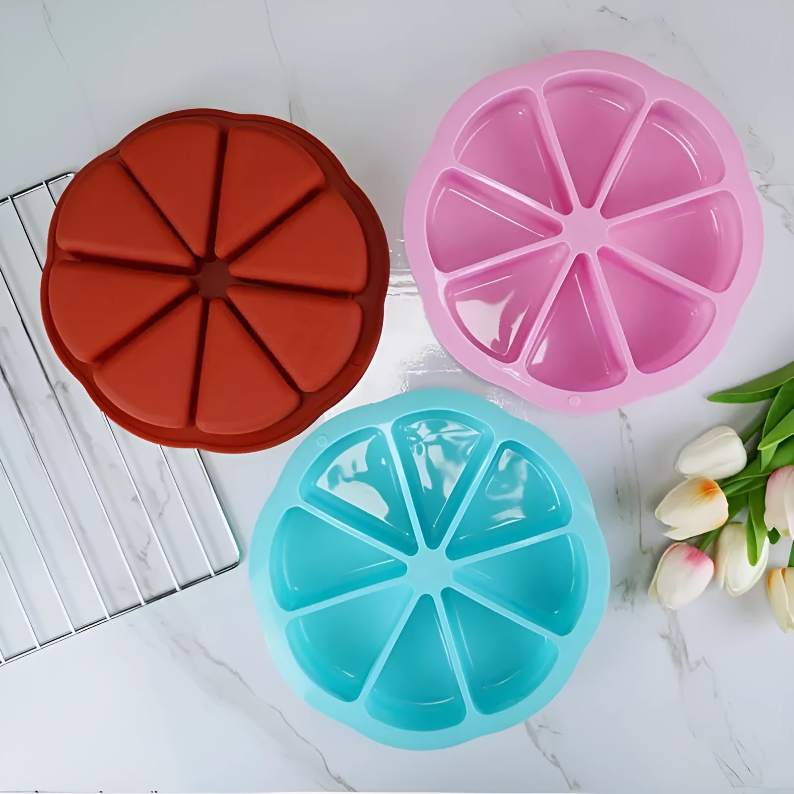 Round silicone cake mold in orange colour for baking, modern simple style, on white background