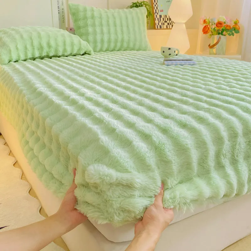 Class A milk fiber fitted sheet with rabbit plush in clear blue, showing elastic edges and smooth surface