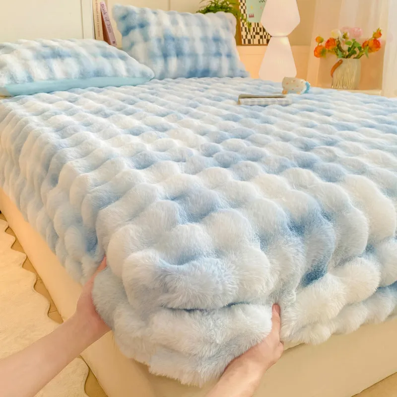 Class A milk fiber fitted sheet with rabbit plush in clear blue, showing elastic edges and smooth surface