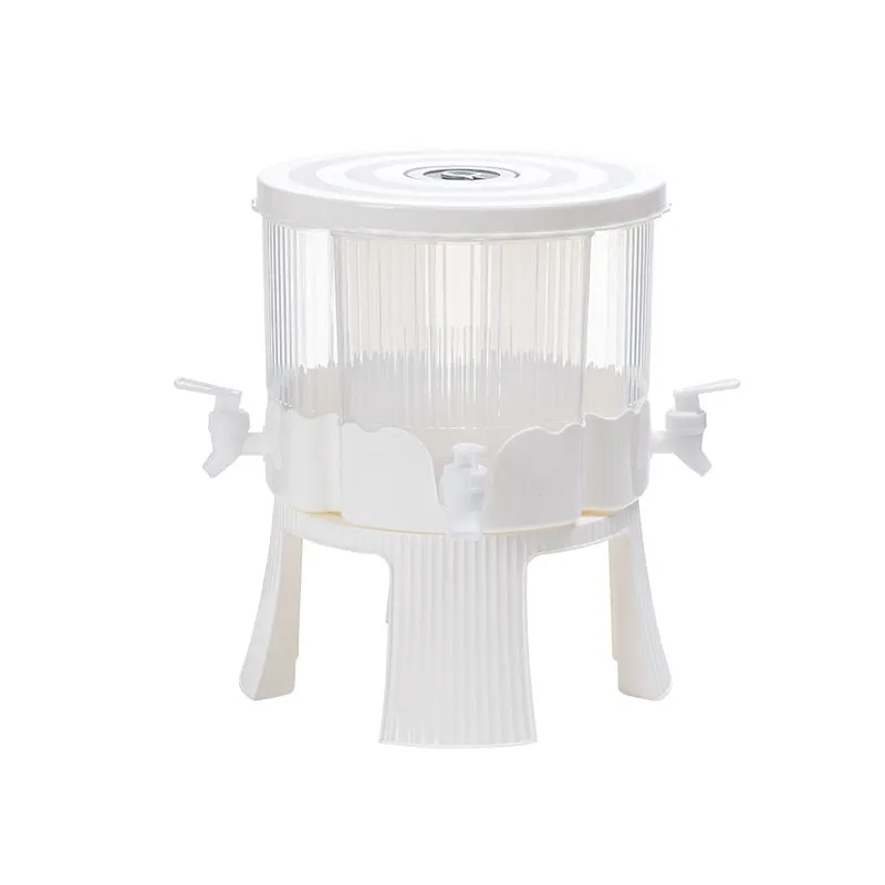 Rotating refrigerator cold water kettle with faucet and glacier pattern finish on kitchen counter