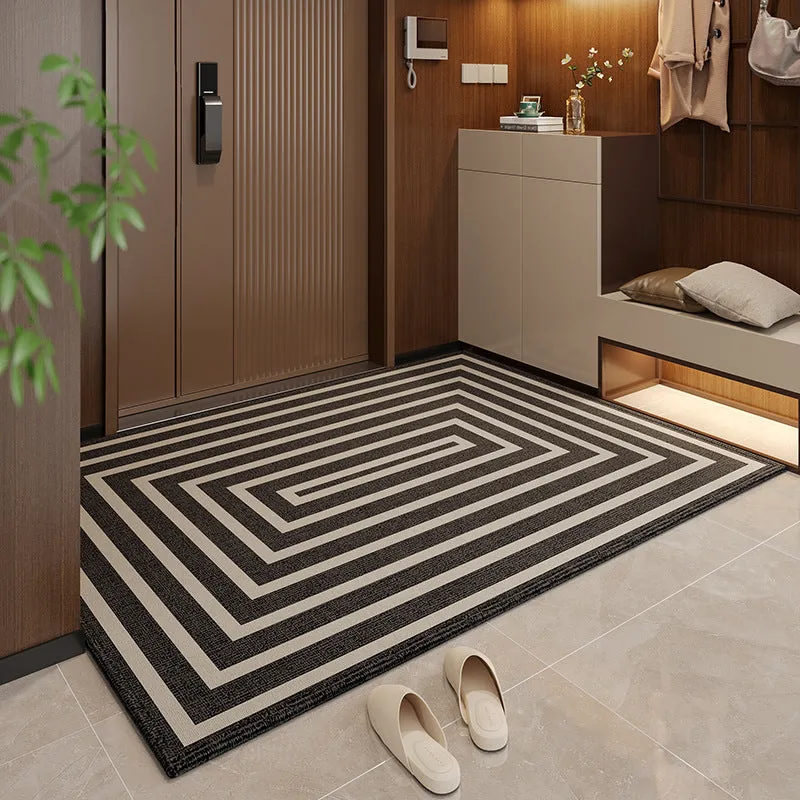 Polyester non-slip entrance door mat with geometric pattern in grey, placed on a tiled floor