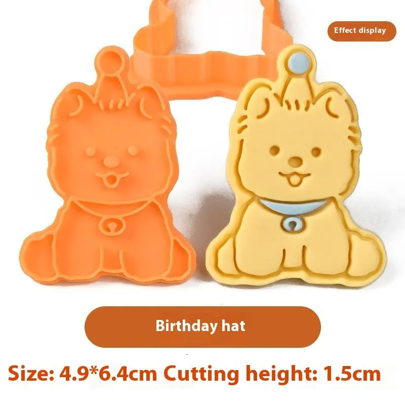 Plastic cartoon biscuit mould showing three-dimensional pet puppy designs including one with a birthday hat