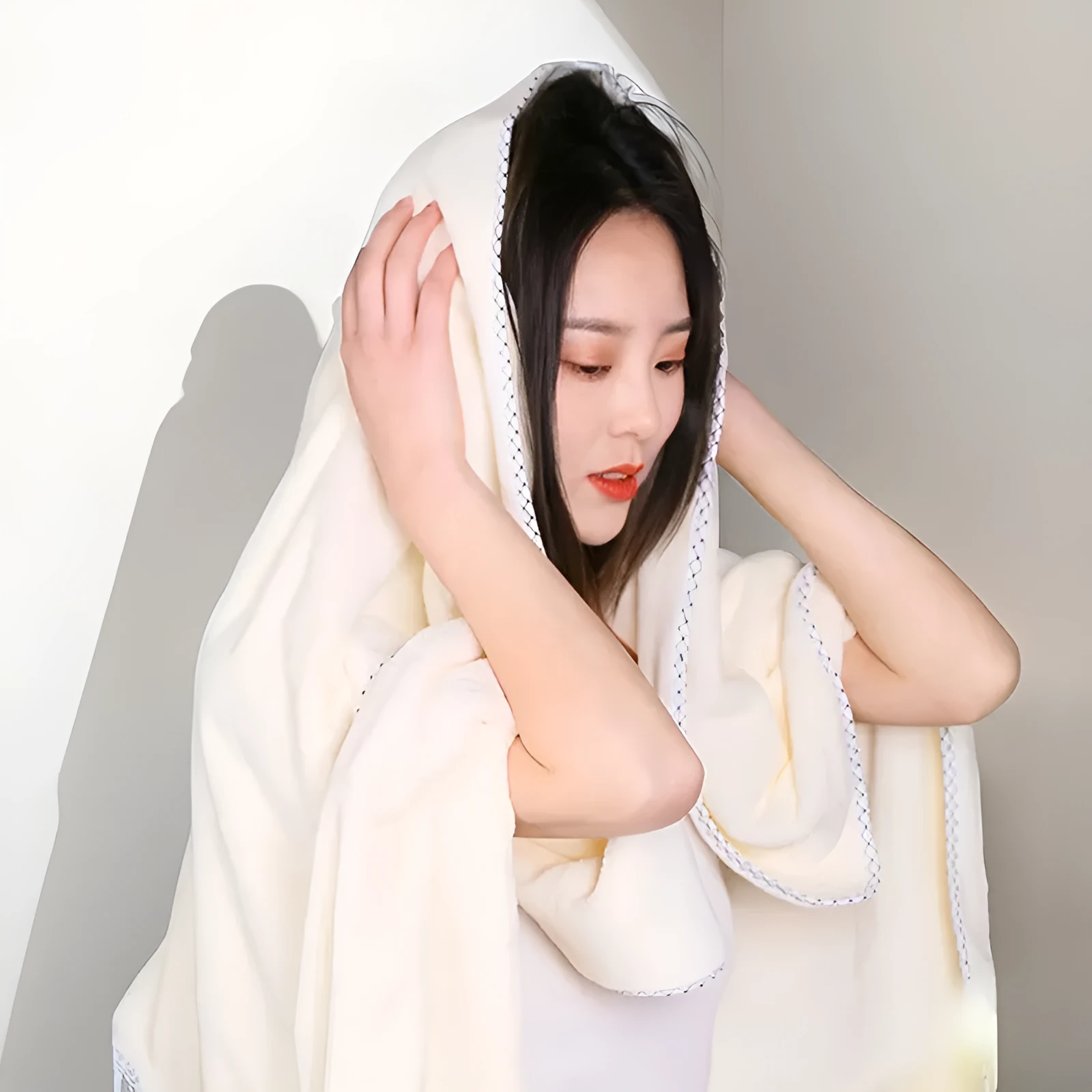 High density coral fleece three-piece towel set in solid vanilla colour with one bath towel and two hand towels